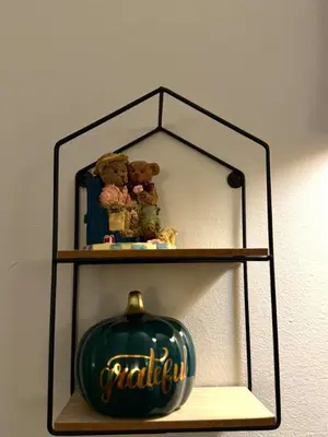 a shelf with two teddy bears on top of it at King Bed Suite with Pool and Hot Tub Access in Shanty Bay