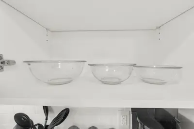 three bowls sitting on a shelf in a refrigerator at Stylish 1BR Condo in Prime Location with Parking and Wi Fi in Kitchener