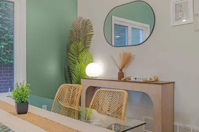 a living room with a fireplace and a mirror at Niagara Retreat|HotTub|Sauna|Games|15 Min to Falls in Thorold
