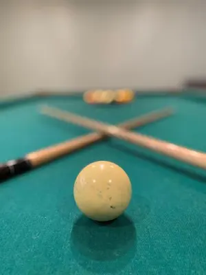 a cue ball on top of a pool table at Private Beach Hot Tub A Vacay to Remember in Hillier