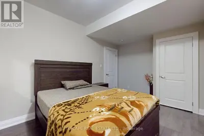 a bedroom with a bed with a zebra blanket on it at Heaven on Earth in Ajax