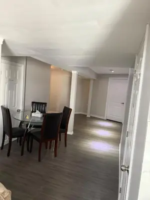 a dining room with a table and chairs at Beautiful&Spacious 2 Bedroom Basement Family Suite in Bradford
