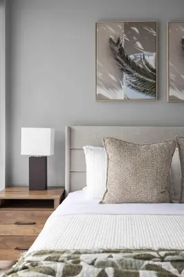 a bedroom with a bed with three pictures on the wall at Chic 1-Bedroom Downtown Toronto Getaway in Toronto