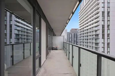 an empty corridor of a building with tall buildings at Chic 1-Bedroom Downtown Toronto Getaway in Toronto