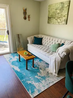 a living room with a couch and a table at Peterborough Cosy Apartment in Peterborough
