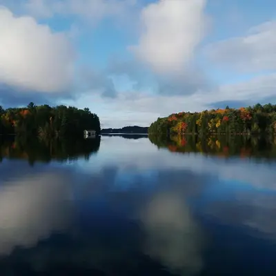 a large lake with a boat in the middle at Olga's Bay Lake House in Minett