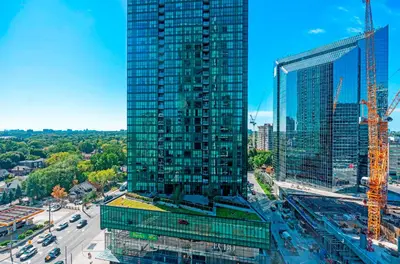 an overhead view of a tall building in a city at Panoramic 2 Bedroom 2 Bathroom Condo Sheppard Metro North York Toronto in Toronto