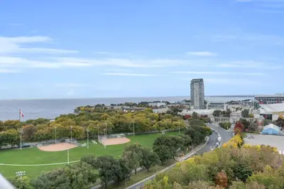 a view of a park with the ocean in the background at Lakeview 1-Bedroom Condo-Downtown Toronto-Free Parking in Toronto