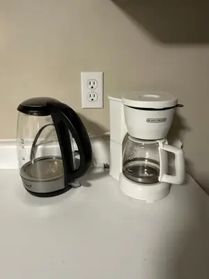 a coffee maker and a coffee pot on a counter at Spacious 2-BR Basement Suite Near Lake Simcoe & Beach Park in Innisfil