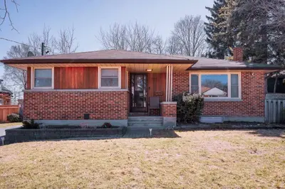 a red brick house with a front door at Bright, Modern & Cozy Getaway Home in the GTA in Whitby