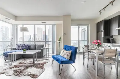 a living room with a couch and a table at Luxury 1BR Suite w Skyline City Views - The Roland in Toronto