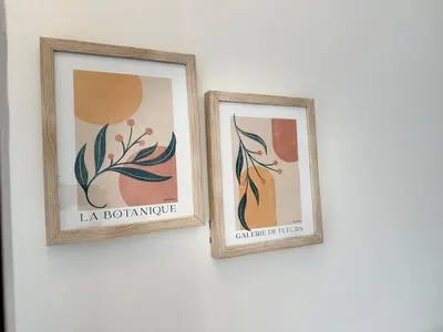 two framed pictures hanging on a wall at Bright Escape Falls Retreat in Niagara Falls