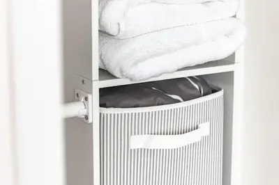 a closet with a trash can and towels at Chic Fort York Studio Cozy Retreat in Downtown TO in Toronto