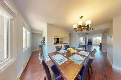a dining room with a wooden table and chairs at Wintergreen 222 in Blue Mountains