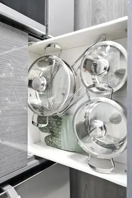 a group of plates and bowls on a shelf in a kitchen at Chic DT TO Studio Getaway Perfect for Couples in Toronto