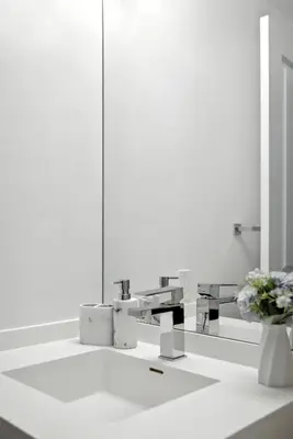 a white bathroom with a sink and a mirror at Luxe Downtown Studio Near Eaton Centre & Transit in Toronto