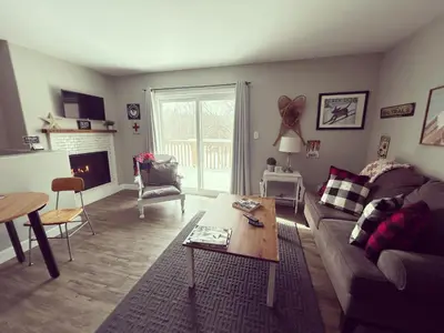 a living room with a couch and a table at The Klinck House in Collingwood