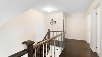 a staircase in a white room with white walls at Modern Bay Vista Getaways in Carrying Place