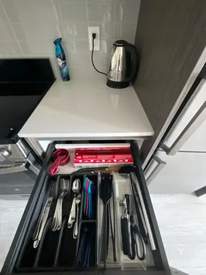 a drawer full of utensils in a refrigerator at New Condo With Large Balcony - The Queensway Retreat in Toronto