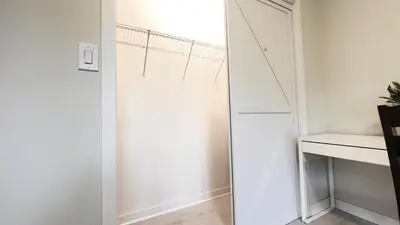 a white closet with a mirror in a room at Modern Room with En Suite Bath Yonge Finch Sub in Toronto