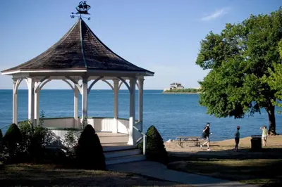 a gazebo on the beach next to the water at Merlot Room in Old Town in Niagara on the Lake