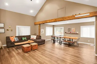 a living room with a couch and a table at Family friendly Getaway Steps to the beach in Fort Erie