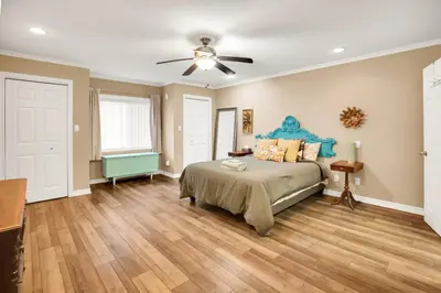 a bedroom with a bed and a ceiling fan at Family friendly Getaway Steps to the beach in Fort Erie