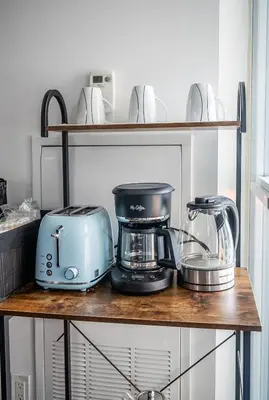 a shelf with a toaster and a blender on it at 1 Bedroom plus Den Condo Garden View Fort York Downtown Toronto in Toronto