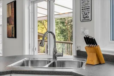 a kitchen counter with a sink and a window at War of 1812 Battlefield Home by Falls in Niagara Falls