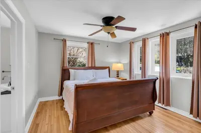 a bedroom with a bed and a ceiling fan at War of 1812 Battlefield Home by Falls in Niagara Falls