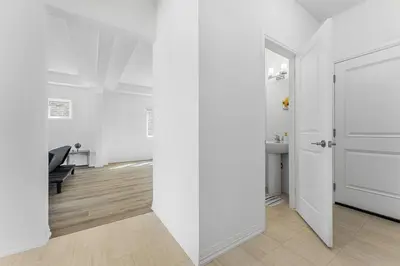 a hallway with white walls and a white door at Luxury New Home By Niagara Fall in Fonthill