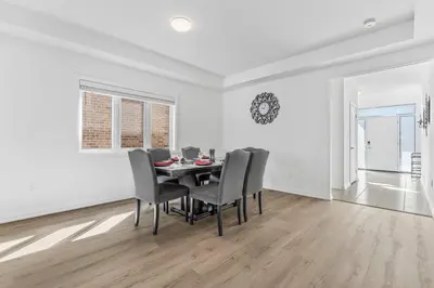 a dining room with a table and chairs at Luxury New Home By Niagara Fall in Fonthill