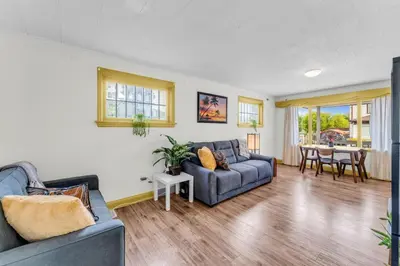 a living room with a couch and a table at Cozy Home Short Walk to Falls Nintendo FirePit in Niagara Falls