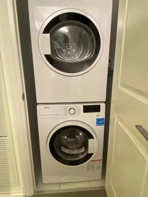 a washing machine and a dryer in a kitchen at Luxury All-Inclusive One-Bedroom Condo in Downtown in Toronto