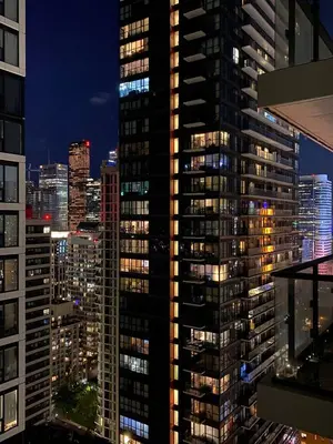 a city skyline at night with tall buildings at Luxury All-Inclusive One-Bedroom Condo in Downtown in Toronto