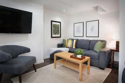 a living room with a couch and a table at East Toronto BNB in Toronto