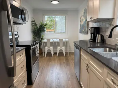 a kitchen with a sink and a counter top at North Barrie !A Stylish and Spacious Private Bedroom with Private Bathroom in Barrie