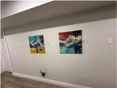 three pieces of art on a white wall at 1-Bedroom 1Bathroom Entire Unit closer to Fairview Mall & Waterloo Airport in Kitchener