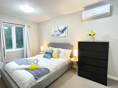 a bedroom with a bed with a dresser and a window at Academic Oasis in London