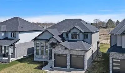 a group of houses with their garage at Fieldstone Estate in Tillsonburg