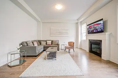 a living room with a couch and a fireplace at Modern Spacious Luxury detached-House new in RH in Richmond Hill