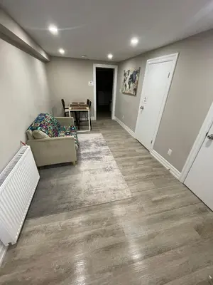 a living room with a couch and a table at Sweet Home in Bloor Downtown-CENTRAL STAY in Toronto