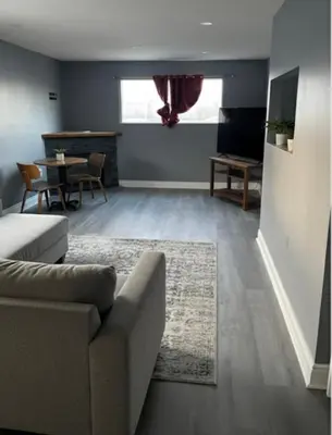 a living room with a couch and a table at Family home in Hamilton