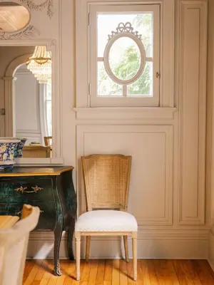 a chair in a room with a desk and a window at Guestroom in Old Town | Steps to Lake & Everything in Niagara on the Lake