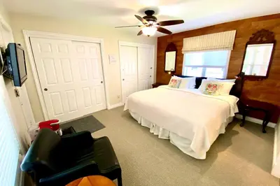 a bedroom with a bed and a ceiling fan at Top 1% Quiet Private Guestroom 2ppl Old Town NOTL in Niagara on the Lake