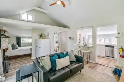 a living room with a couch and a bedroom at Top 5% Tiny Home by River/Lake in Old Town NOTL in Niagara on the Lake