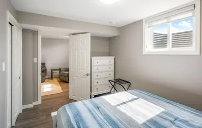 a bedroom with a bed and a window at Single Level Vineyard Home | 6 PPL | Pet Friendly in Niagara on the Lake