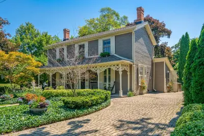 an old house with a brick driveway at Hot Tub | Heart of Old Town NOTL | 2 Guests in Niagara on the Lake
