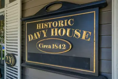 a sign for ahistoric day house on the side of a house at Hot Tub | Heart of Old Town NOTL | 2 Guests in Niagara on the Lake