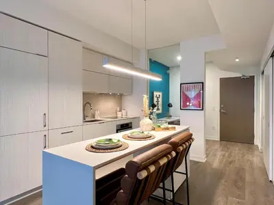 a kitchen with a large island with a counter top at Deluxe Suites Downtown Toronto in Toronto